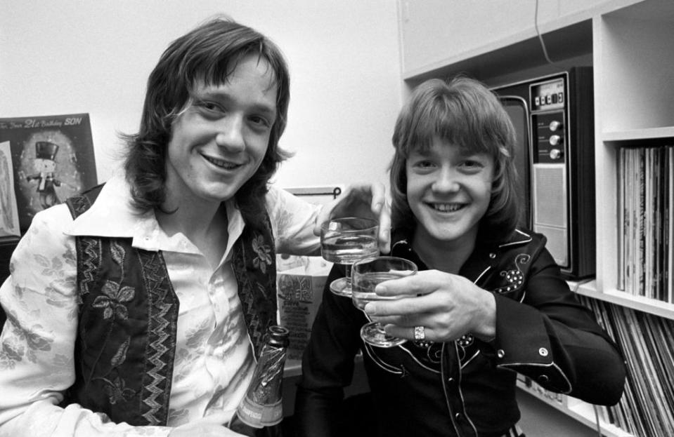 Keith Chegwin (right) and his twin brother Jeff celebrating their 21st birthday in Twickenham, London. (Credit: PA)