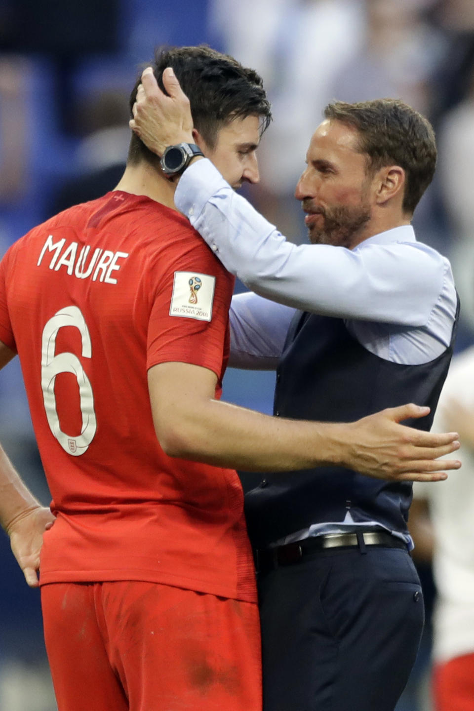 <p>England boss Gareth Southgate, right, celebrates Harry Maguire </p>