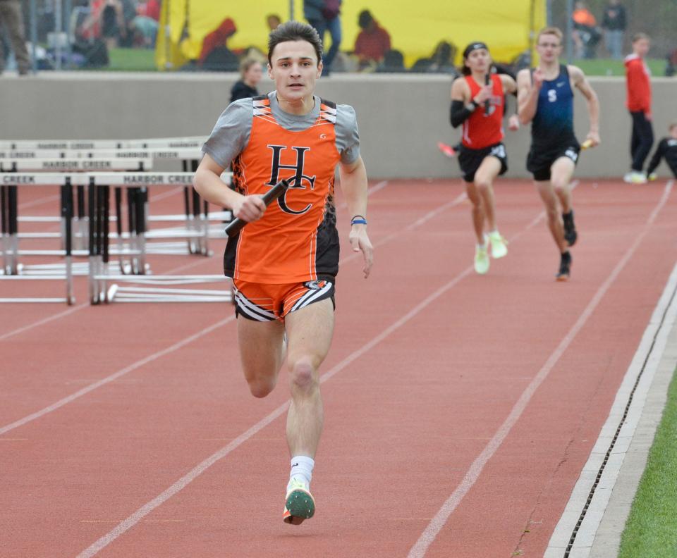 Harbor Creek High School senior Max Dailey finishes the final leg of the 3,200-meter relay to help the Huskies win the event during the Harbor Creek track and field invitational at Paul J. Weitz Stadium in Harborcreek Township on Saturday.  He also won the 800 meters.