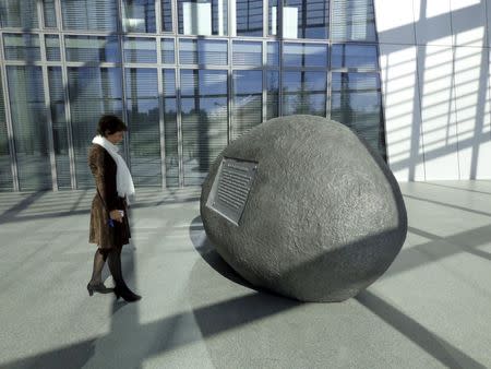 A woman looks at an artwork by Nedko Solakov of Bulgaria inside the European Central Bank's headquarters in Frankfurt, Germany, October 2, 2015. REUTERS/Balazs Koranyi