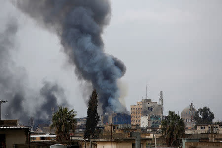 Smoke rises from clashes during a battle between Iraqi forces and Islamic State militants in the city of Mosul. REUTERS/Youssef Boudlal