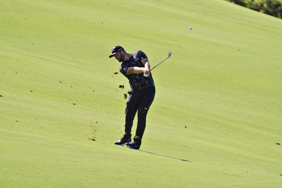 Jon Rahm, of Spain, hits from the 10th fairway during the second round of the Tournament of Champions golf event, Friday, Jan. 7, 2022, at Kapalua Plantation Course in Kapalua, Hawaii. (AP Photo/Matt York)