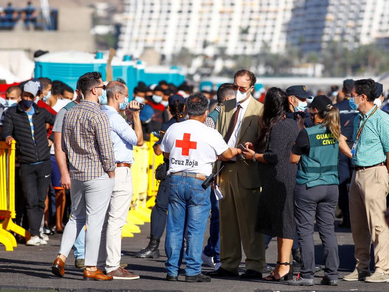 A judicial and police commission visit the camp where migrants rest after being rescued by coast guards or reached the island by their own means, in the Arguineguin harbour, on the island of Gran Canaria