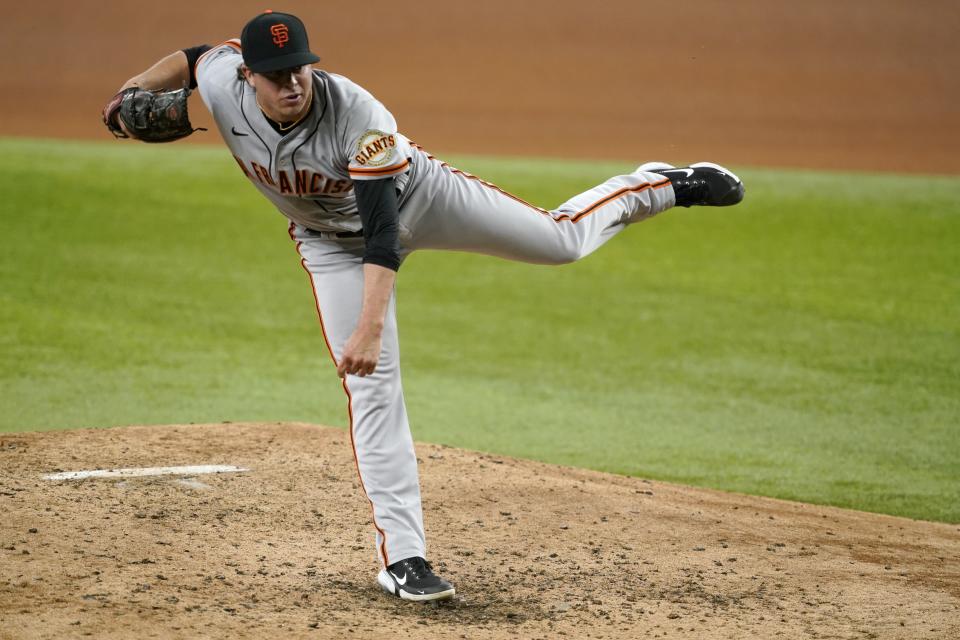 San Francisco Giants relief pitcher Sammy Long follows through on his delivery to the Texas Rangers in the fourth inning of a baseball game in Arlington, Texas, Wednesday, June 9, 2021. (AP Photo/Tony Gutierrez)
