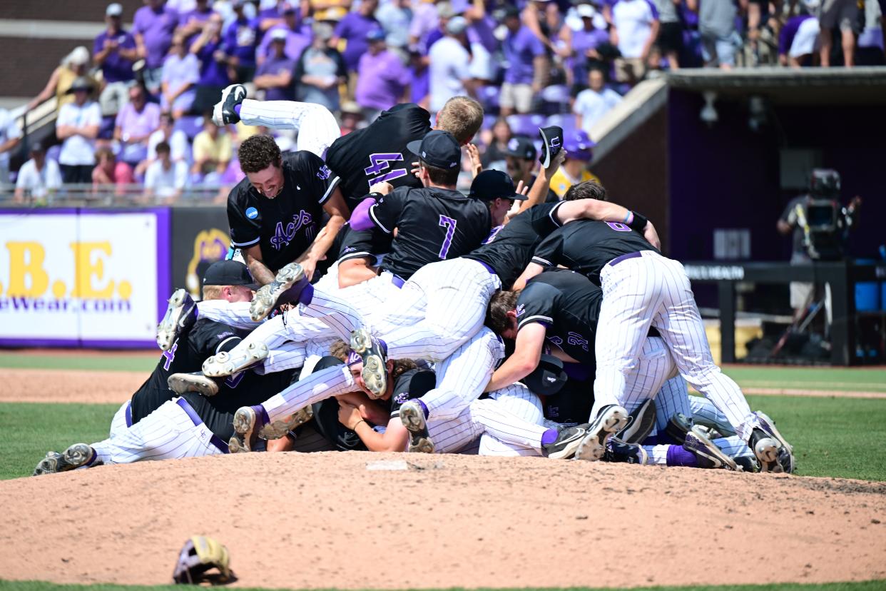 The University of Evansville baseball team dogpiles on the pitcher's mound after winning Monday's NCAA Tournament Greenville Regional championship over East Carolina to advance to the Sweet 16.