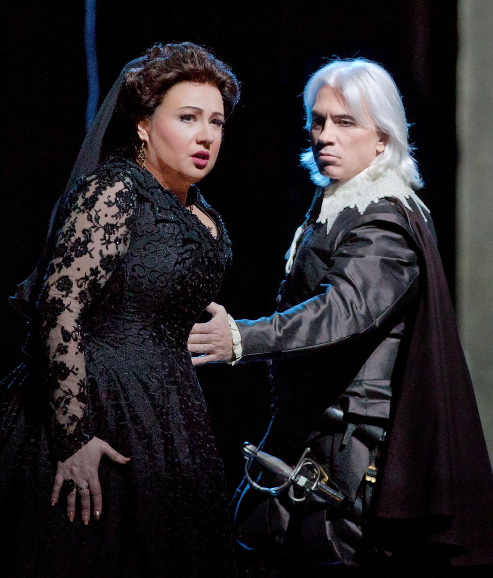 In this Feb. 14, 2013 photo provided by the Metropolitan Opera, Anna Smirnova plays Ebolige and Dmitri Hvorostovsky as Rodrigo during a dress rehearsal of “Don Carlo” at the Metropolitan Opera in New York. (AP Photo/Metropolitan Opera, Ken Howard