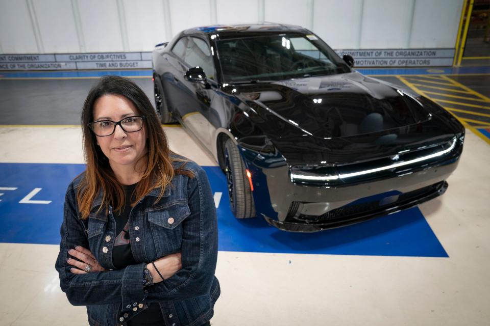 Audrey Moore, the chief engineer of DodgeÕs first electric muscle car, the 2024 Dodge Charger EV, poses with the car on Friday, April 19, 2024 at the Stellantis Windsor Assembly Plant in Windsor, Ontario.