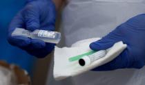A test kit is seen at a drive-in test center for coronavirus disease (COVID-19) gargle tests at the Ernst Happel Stadium in Vienna