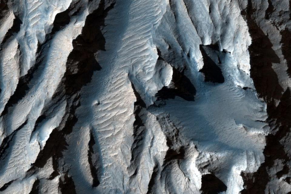 <p>A close-up view of Tithonium Chasma, which is feature of Valles Marineris, the solar system's largest canyon.</p> (NASA/JPL/UArizona)