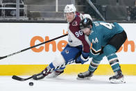 Colorado Avalanche right wing Mikko Rantanen (96) battles for the puck against San Jose Sharks defenseman Marc-Edouard Vlasic (44) during the second period of an NHL hockey game in San Jose, Calif., on Wednesday, May 5, 2021. (AP Photo/Tony Avelar)