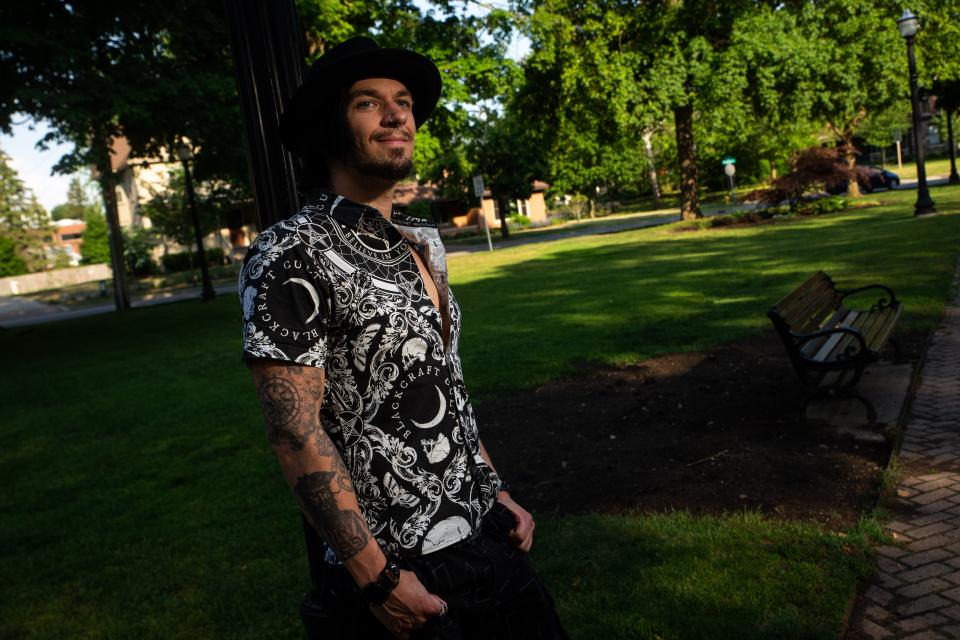 Bendr Bones, an ordained minister with the Satanic Temple, poses for a portrait Thursday, June 1, 2023, at Centennial  Park in Holland.