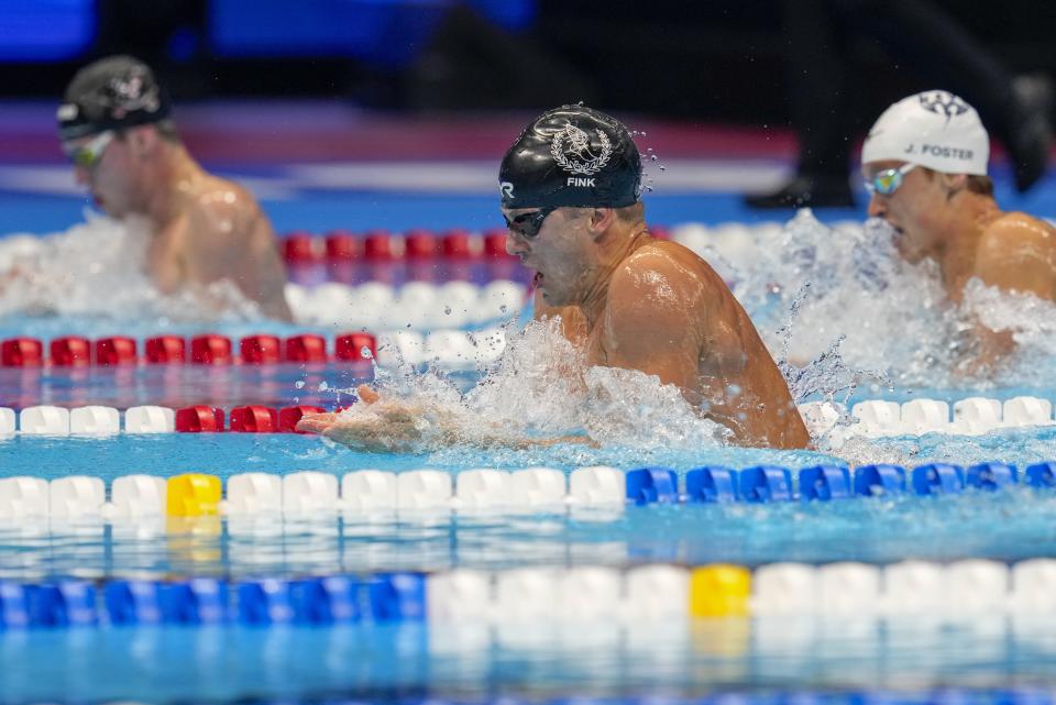 Nic Fink swims during the Men's 100 breaststroke finals Sunday, June 16, 2024, at the US Swimming Olympic Trials in Indianapolis. (AP Photo/Michael Conroy)