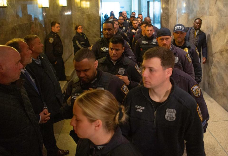 At least a hundred NYPD officers attended the arraignment. James Messerschmidt