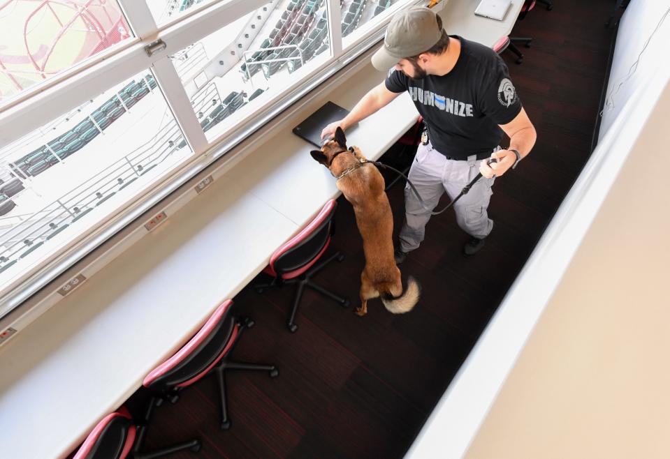 Aug 4, 2022; Tuscaloosa, AL, USA; Tuscaloosa County Sheriff’s deputy Jonathan Rice and his K-9 partner Bingo go through the press box at Sewell-Thomas Stadium. The Department of Homeland Security Science and Technology Directorate’s Regional Explosives Detection Dog Initiative conducted training for the canines and their handlers at the University of Alabama Thursday, Aug. 4, 2022.. Mandatory Credit: Gary Cosby Jr.-Tuscaloosa News