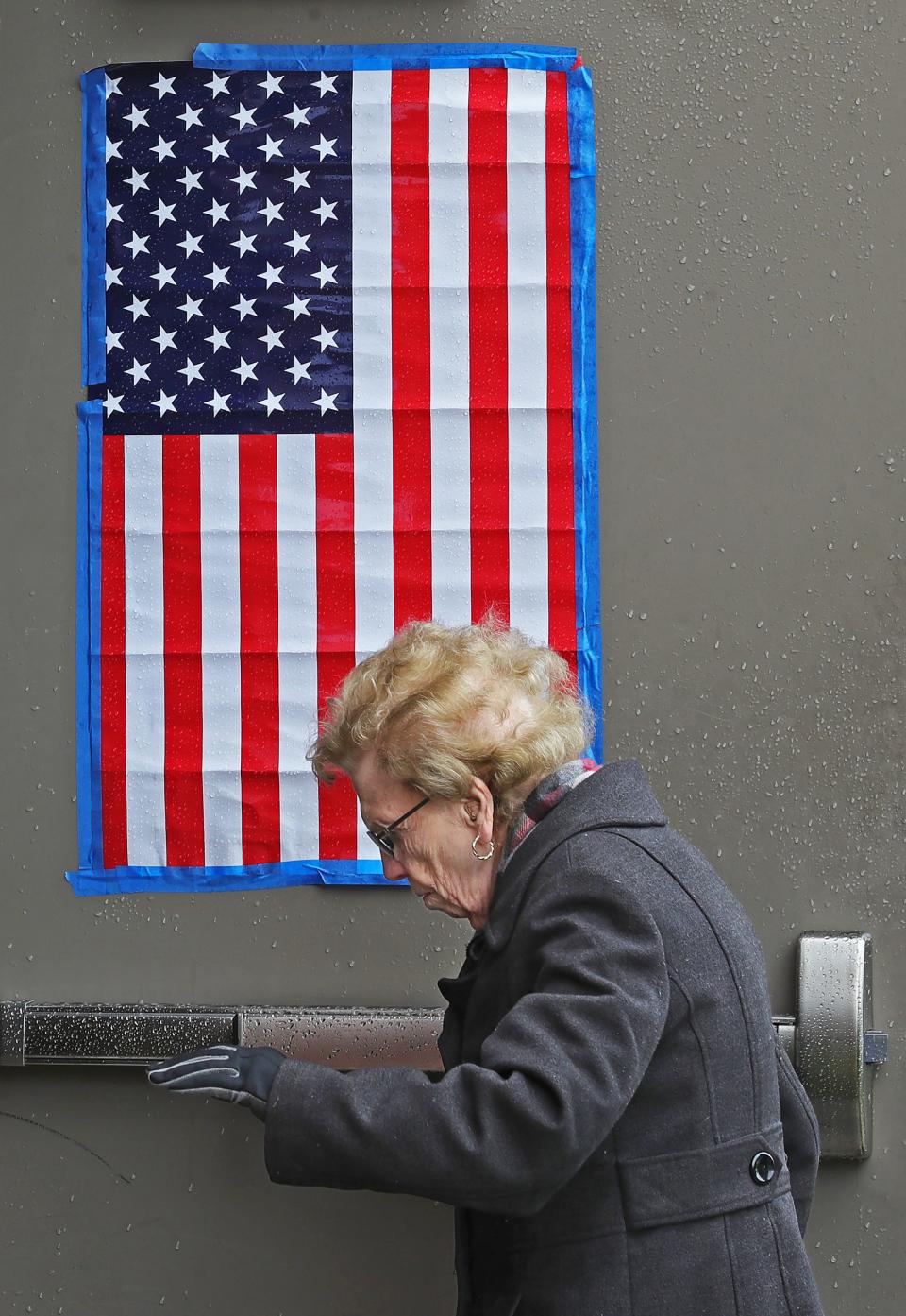 Lifelong Akron resident Betty Post, 97, makes her way into the auxiliary gym at Ellet CLC to cast her vote for mayoral candidate Tara Mosley. Betty said she would like to see a woman as mayor in her lifetime.