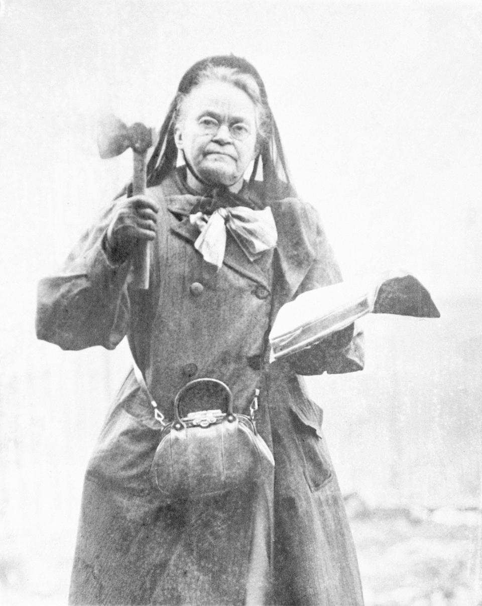 In this 1910 file photo temperance leader Carrie Nation wields her hatchet and bible in 1910. Nation has destroyed more than a few saloons with her hatchet. Ratification of the 18th Amendment in 1919, which set the stage for Prohibition's launch a year later, culminated a century of advocacy by the temperance movement. Leading forces included the Women's Christian Temperance Union, the Anti-Saloon League and many Protestant denominations.