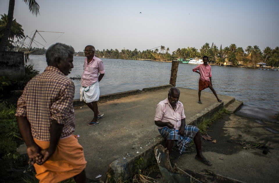 Elderly men idle away an evening by the backwaters in Kochi, Kerala state, India, March 10, 2023. In this coastal state in India's southern tip, the aging population provides a stark contrast to the young India of the north. The most literate state in India, Kerala is also the fastest aging part of the country. Declining fertility and increasing longevity have been contributing to the demographic shifts in the State. (AP Photo/ R S Iyer)