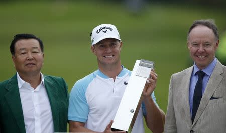 Britain Golf - BMW PGA Championship - Wentworth Club, Virginia Water, Surrey, England - 28/5/17 Sweden's Alex Noren celebrates winning the BMW PGA Championship with the trophy Action Images via Reuters / Paul Childs Livepic