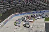 Drivers head into the front stretch as they get the green flag during a NASCAR Truck Series auto race at Texas Motor Speedway in Fort Worth, Texas, Saturday, June 12, 2021. (AP Photo/Larry Papke)