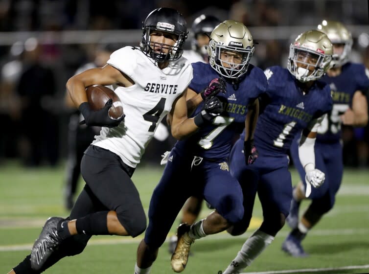 SHERMAN OAKS, CALIF. - SEP. 27, 2019. Servite wide receiver Tetairoa Mcmillan gets big yardage after a making a catch against Notre Dame in the second quarter in Sherman Oaks on Friday night, Sep. 27, 2019. (Luis Sinco/Los Angeles Times)