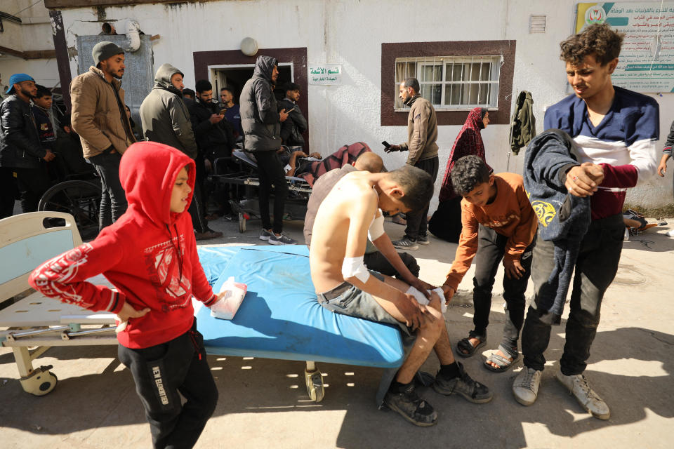 Palestinians receive medical care at Kamal Edwan Hospital in Beit Lahia, in the northern Gaza Strip, Feb. 29, 2024, after Israeli soldiers allegedly opened fire at Gaza residents who rushed toward trucks loaded with humanitarian aid. / Credit: AFP via Getty