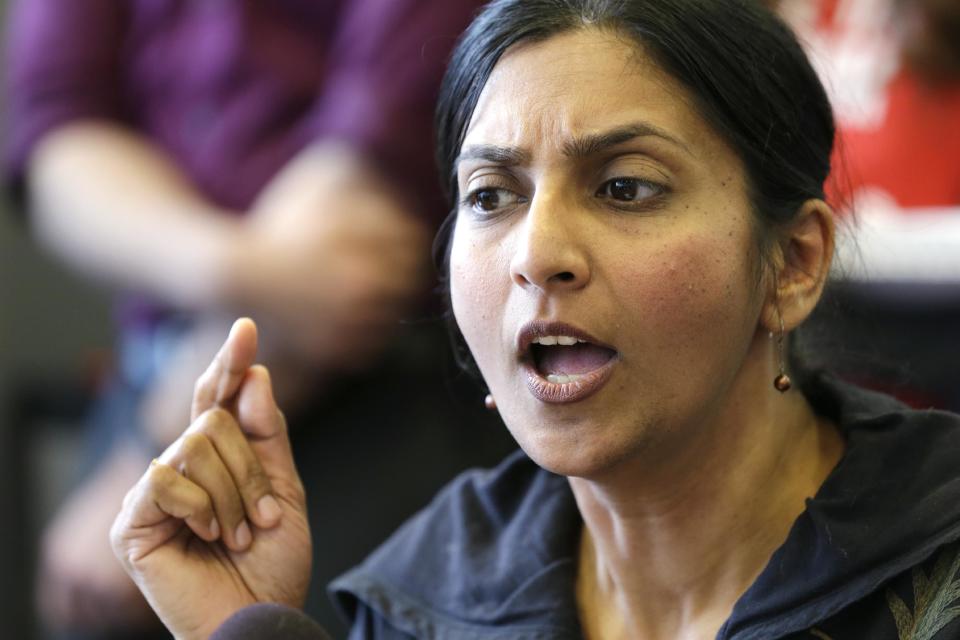 Seattle City Council Member Kshama Sawant addresses a news conference on a proposal to increase the minimum wage in the city Thursday, April 24, 2014, in Seattle. The Mayor Ed Murray earlier said his advisory group of business, labor, non-profits and other representatives have not yet agreed on a plan to increase the minimum wage to $15 an hour. (AP Photo/Elaine Thompson)