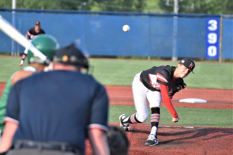 Isaak Yoder delivers against Newark Catholic. The junior fanned five without walking a batter.