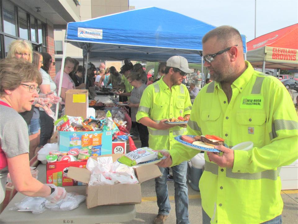 New River Electrical workers and other visiting utility crews enjoyed Holmes County hospitality Sunday at a picnic to thank the utility workers for their efforts this past week.