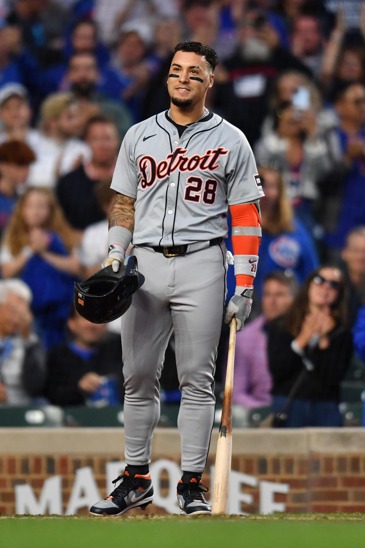 Detroit Tigers shortstop Javier Baez reacts to his standing ovation for his first game back at Wrigley Field during the second inning in a game on Tuesday, Aug. 20, 2024, in Chicago.