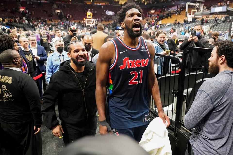 Rapper, Drake and Joel Embiid #21 of the Philadelphia 76ers leave the arena after Round 1 Game 3 of the 2022 NBA Playoffs on April 20, 2022 at the Scotiabank Arena in Toronto, Ontario, Canada.