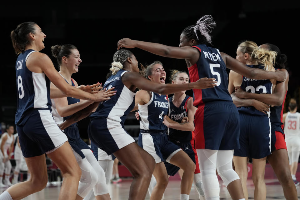 France players celebrate after their win over Serbia in a women's basketball bronze medal game at the 2020 Summer Olympics, Saturday, Aug. 7, 2021, in Saitama, Japan. (AP Photo/Eric Gay)