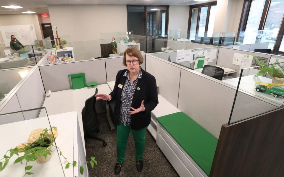 Sandra Reid, vice oresident of corporate communications and strategic panning at The Davey Tree Expert Company, talks about the work spaces and the natural light from windows during an open and tour.