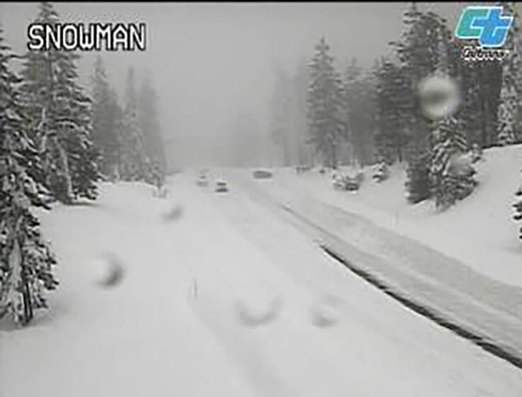 This image from a Caltrans traffic camera shows snow conditions on California SR-89 Snowman in Shasta-Trinity National Forest, Calif., Saturday, Dec. 10, 2022. A stretch of California Highway 89 was closed due to heavy snow between Tahoe City and South Lake Tahoe, Cali., the highway patrol said. Interstate 80 between Reno and Sacramento remained open but chains were required on tires for most vehicles. (Caltrans via AP)