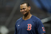 Boston Red Sox third baseman Rafael Devers smiles as he walks onto the field during the baseball team's practice Wednesday, Oct. 6, 2021, in St. Petersburg, Fla., for an AL Division Series matchup against the Tampa Bay Rays that starts Thursday. (AP Photo/Chris O'Meara)