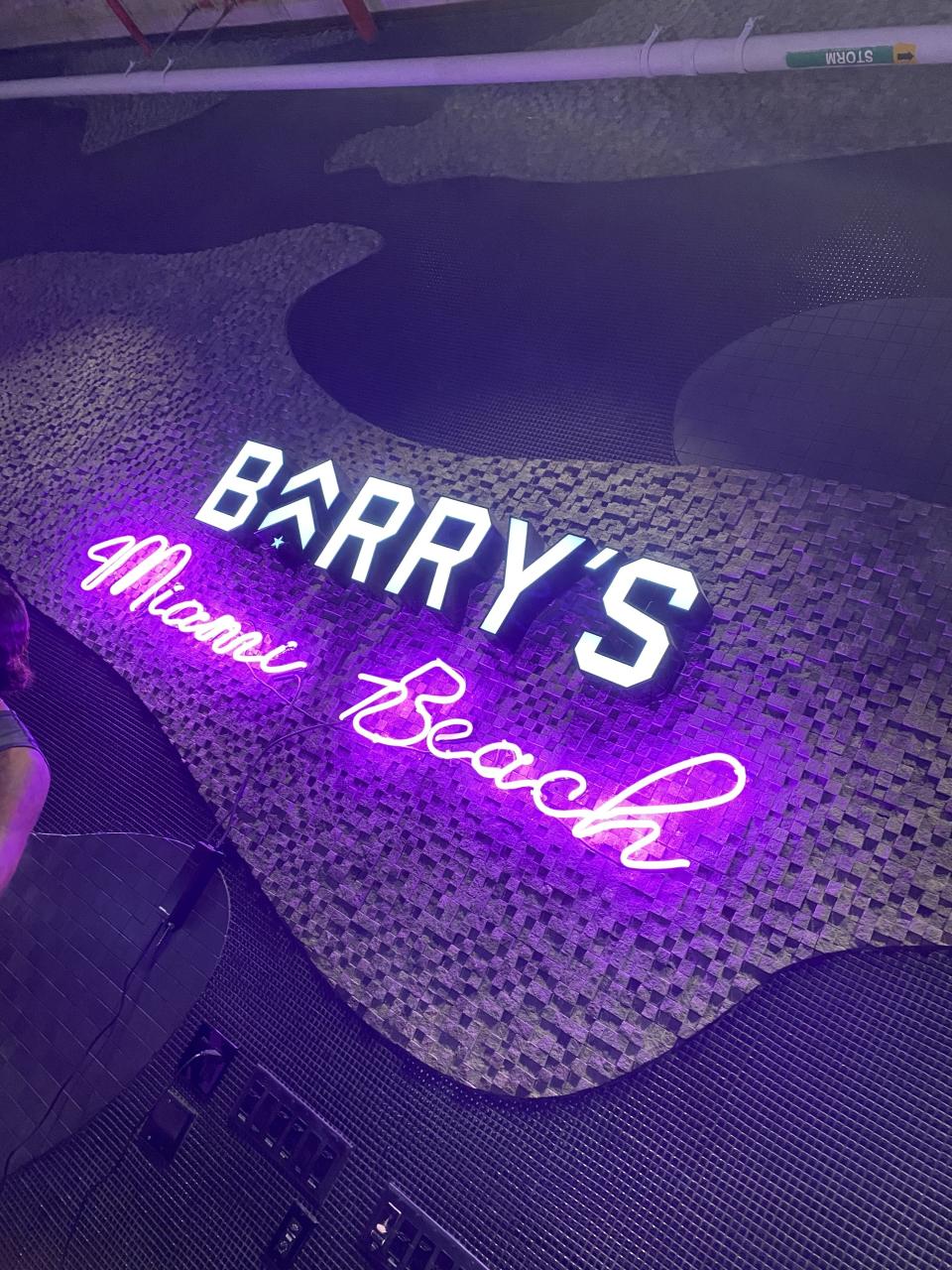 sign that says, Barry's Miami Beach