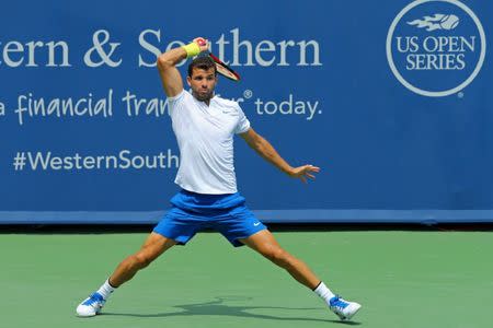 Aug 19, 2017; Mason, OH, USA; Grigor Dimitrov (ESP) returns a shot against John Isner (USA) during the Western and Southern Open at the Lindner Family Tennis Center. Mandatory Credit: Aaron Doster-USA TODAY Sports