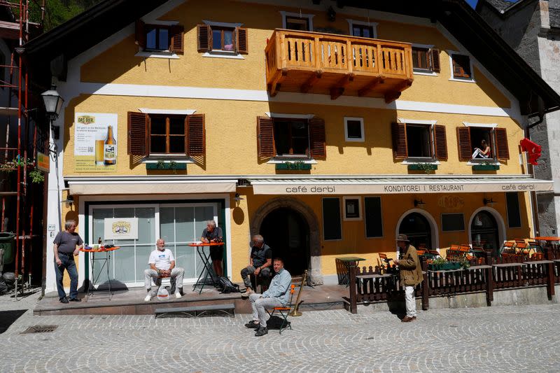 Locals enjoy a sunny day in the city of Hallstatt