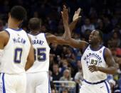 Dec 1, 2017; Orlando, FL, USA; Golden State Warriors forward Draymond Green (23) and Golden State Warriors forward Kevin Durant (35) high five against the Orlando Magic during the second quarter at Amway Center. Mandatory Credit: Kim Klement-USA TODAY Sports