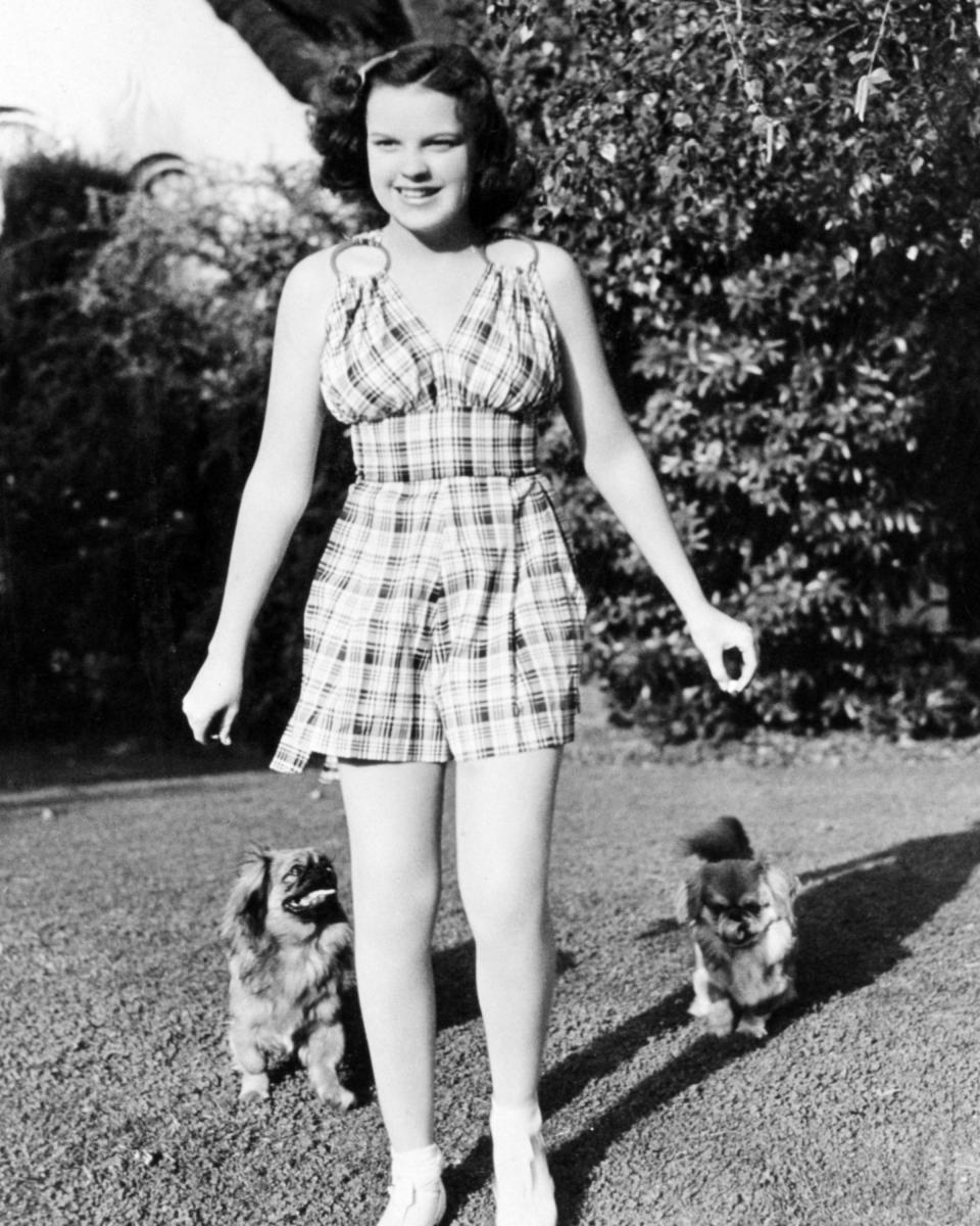 Garland with two pet dogs, circa 1940.