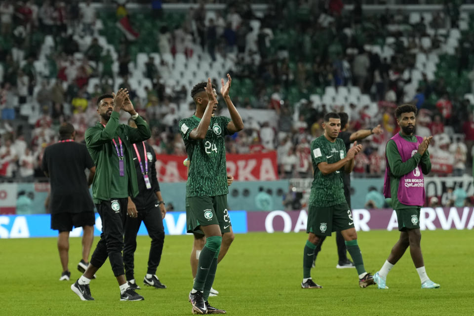 Saudi Arabia players applaud fans at the end of the World Cup group C soccer match between Poland and Saudi Arabia, at the Education City Stadium in Al Rayyan , Qatar, Saturday, Nov. 26, 2022. (AP Photo/Francisco Seco)