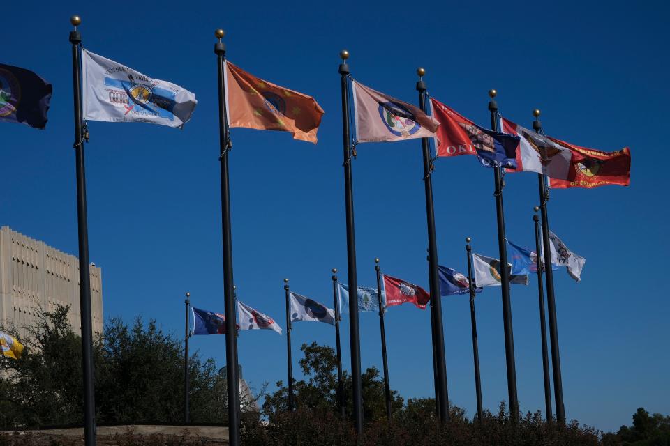 The flags of several Oklahoma tribal nations fly outside the state capitol in this 2023 file photo.