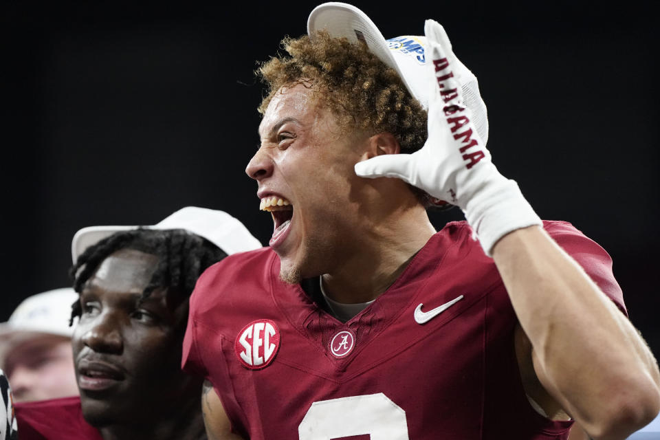 Alabama wide receiver Jermaine Burton (3) celebrates after a win against Georgia after the Southeastern Conference championship NCAA college football game in Atlanta, Saturday, Dec. 2, 2023. (AP Photo/Mike Stewart)