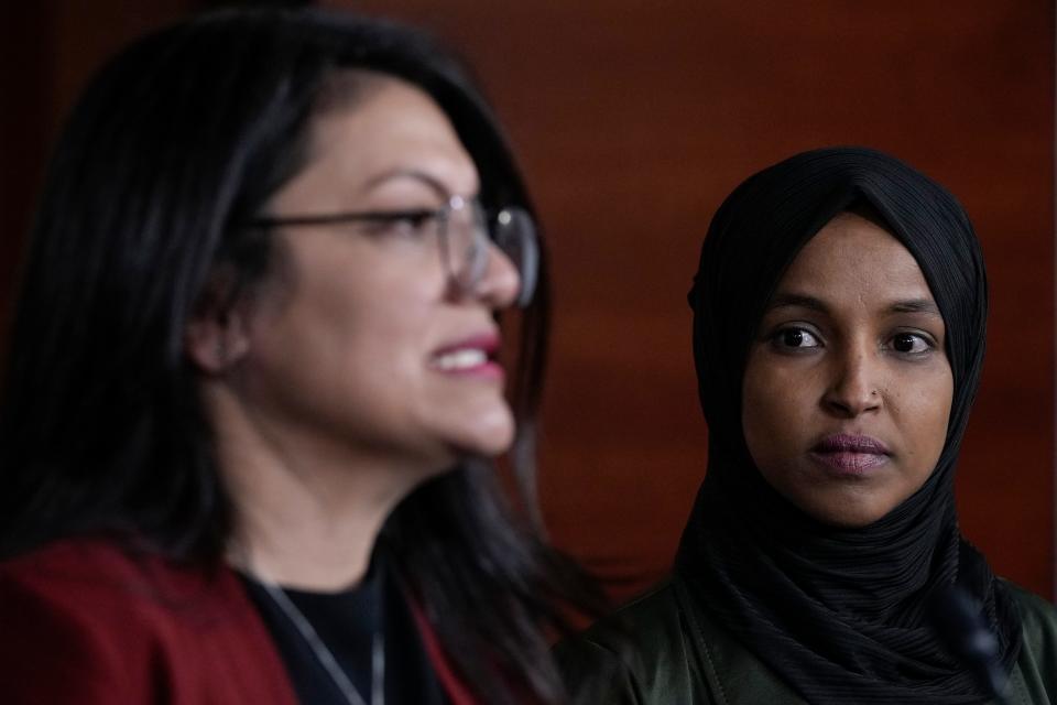 Rep. Ilhan Omar (D-MN) listens as Rep. Rashida Tlaib (D-MN) speaks during a news conference about Islamophobia on Capitol Hill on November 30, 2021 in Washington, DC. A video of Rep. Lauren Boebert (R-CO) circulated on social media last week of the conservative lawmaker making anti-Muslim remarks about Rep. Ilhan Omar.