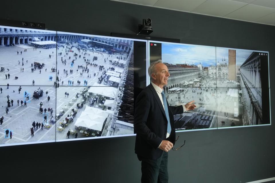 Marco Bettini, director of Venis Informatics System, gestures as he talks to reporters at the police Venice control room, in Venice, Italy, Wednesday, April 24, 2024. The lagoon city of Venice begins a pilot program Thursday, April 25, 2024 to charge daytrippers a 5 euro entry fee that authorities hope will discourage tourists from arriving on peak days. Officials expect some 10,000 people will pay the fee to access the city on the first day, downloading a QR code to prove their payment. (AP Photo/Luca Bruno)