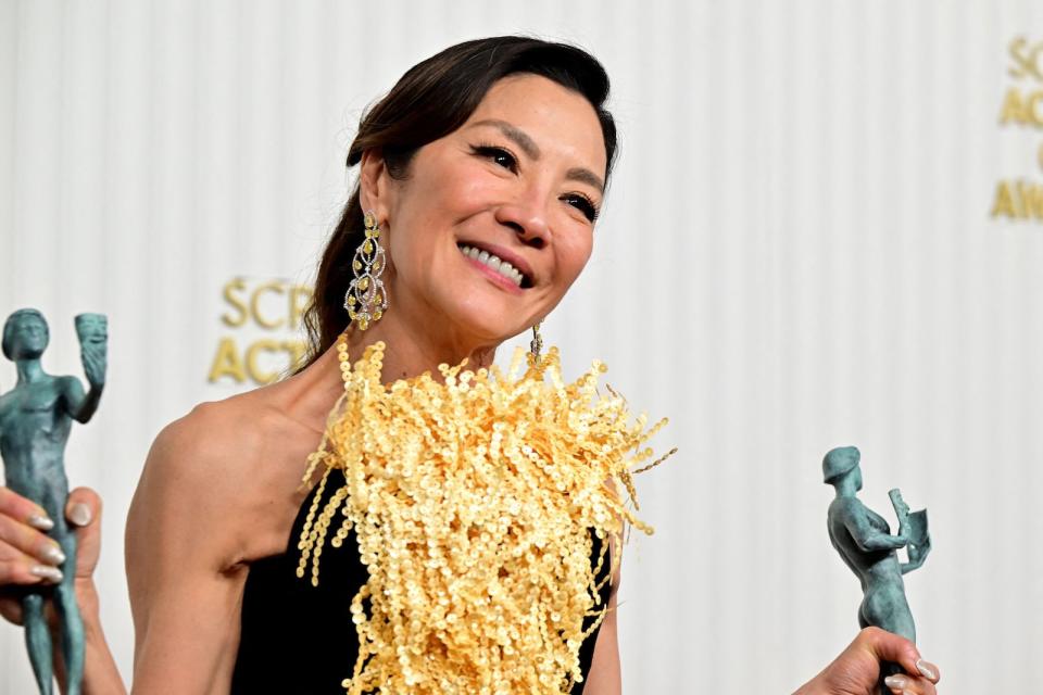 Malaysian celebrity Michelle Yeoh at the Screen Actors Guild Awards with her award trophies