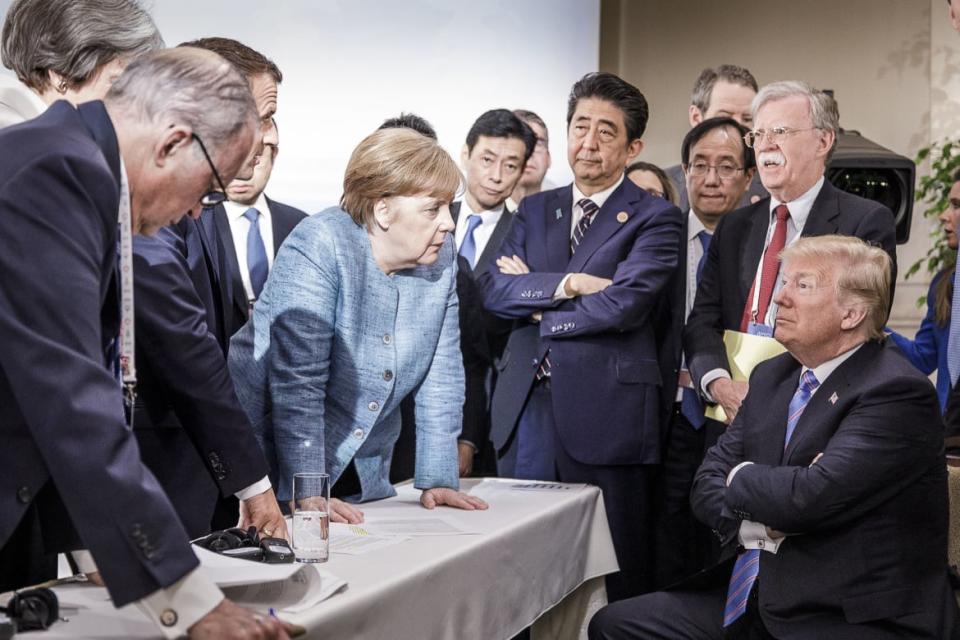 <div class="inline-image__caption"><p>In this photo provided by the German Government Press Office (BPA), German Chancellor Angela Merkel deliberates with US president Donald Trump on the sidelines of the official agenda on the second day of the G7 summit on June 9, 2018 in Charlevoix, Canada. Also pictured are (L-R) Larry Kudlow, director of the US National Economic Council, Theresa May, UK prime minister, Emmanuel Macron, French president, Angela Merkel, Yasutoshi Nishimura, Japanese deputy chief cabinet secretary, Shinzo Abe, Japan prime minister, Kazuyuki Yamazaki, Japanese senior deputy minister for foreign affairs, John Bolton, US national security adviser, and Donald Trump. Canada are hosting the leaders of the UK, Italy, the US, France, Germany and Japan for the two day summit. </p></div> <div class="inline-image__credit">Jesco Denzel /Bundesregierung via Getty</div>