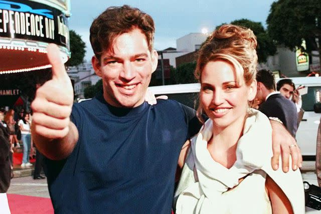 <p>JEFF HAYNES/AFP via Getty</p> Harry Connick Jr. and wife Jill Goodacre in 1996