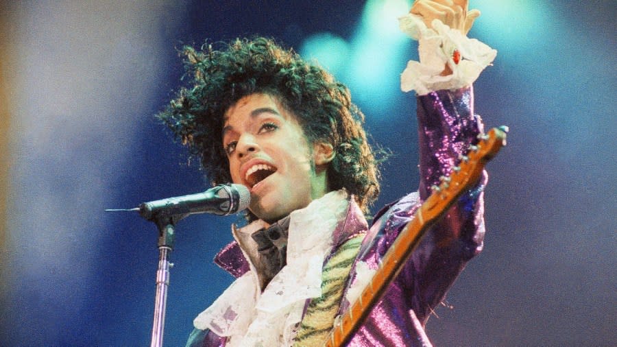 Prince performs at the Forum in Feb. 1985, in Inglewood, California. Fans of Prince, who was known nearly as much for his extravagant wardrobe as for his chart-topping hits, will have a chance to bid on some of the late musician’s sartorial splendor in an online auction running through Thursday. (Photo: Liu Heung Shing/AP, File)