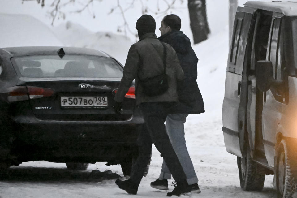 Wall Street Journal reporter Evan Gershkovich, right, is escorted to the Lefortovsky court in Moscow, Russia, Friday, Jan. 26, 2024. A Moscow court will decide on January 26, 2024 whether to extend the pre-trial detention of detained Wall Street Journal reporter Evan Gershkovich, who was detained last March on spying charges during a reporting trip to the Urals. (Alexander Nemenov/Pool Photo via AP)