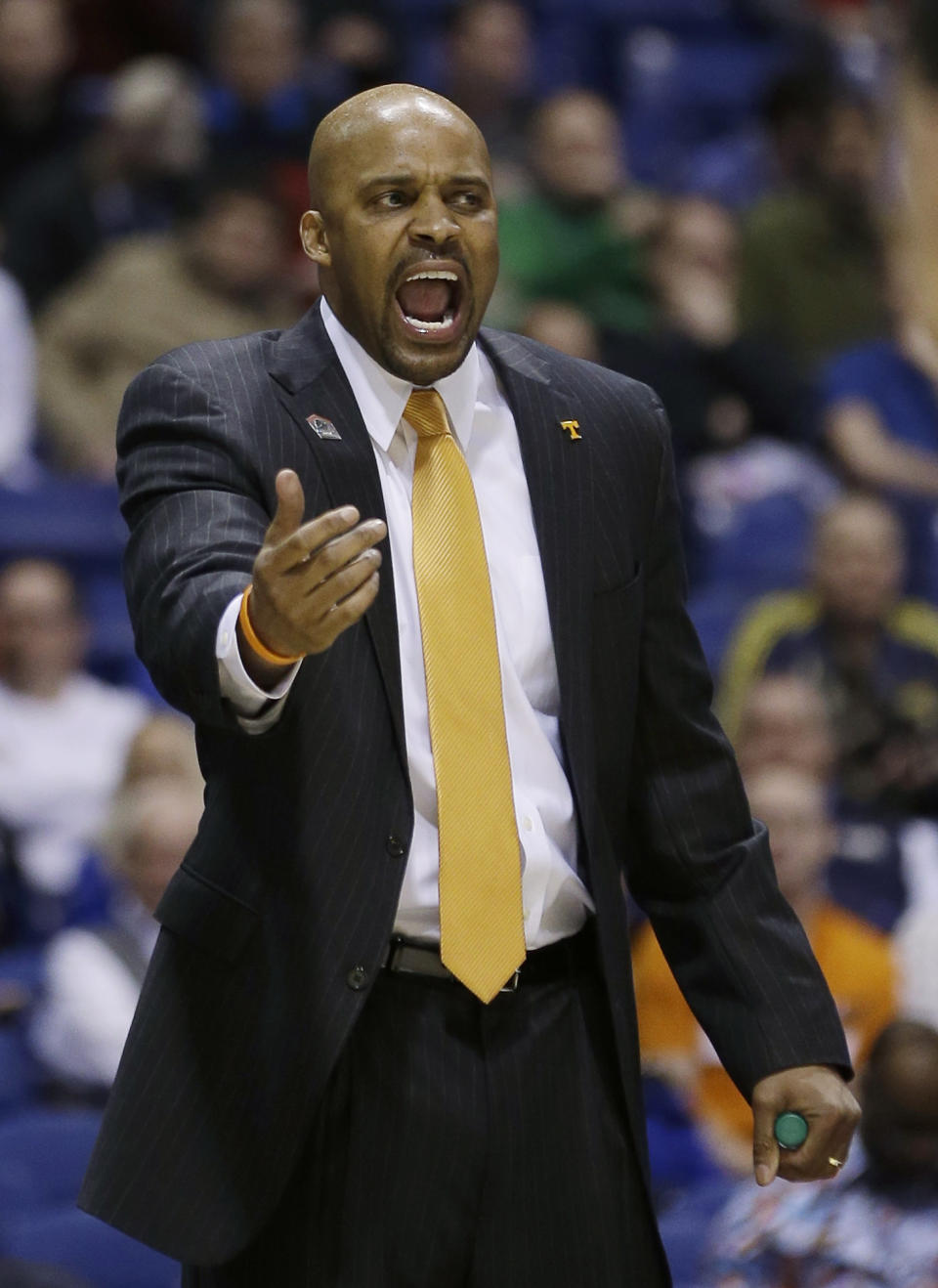 Tennessee head coach Cuonzo Martin yells during the first half of an NCAA Midwest Regional semifinal college basketball tournament game against the Michigan Friday, March 28, 2014, in Indianapolis. (AP Photo/David J. Phillip)